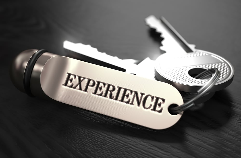 Experience Concept. Keys with Keyring on Black Wooden Table. Closeup View, Selective Focus, 3D Render. Black and White Image. Experience Concept. Keys with Keyring on Black Wooden Table. Closeup View, Selective Focus, 3D Render. Black and White Image.